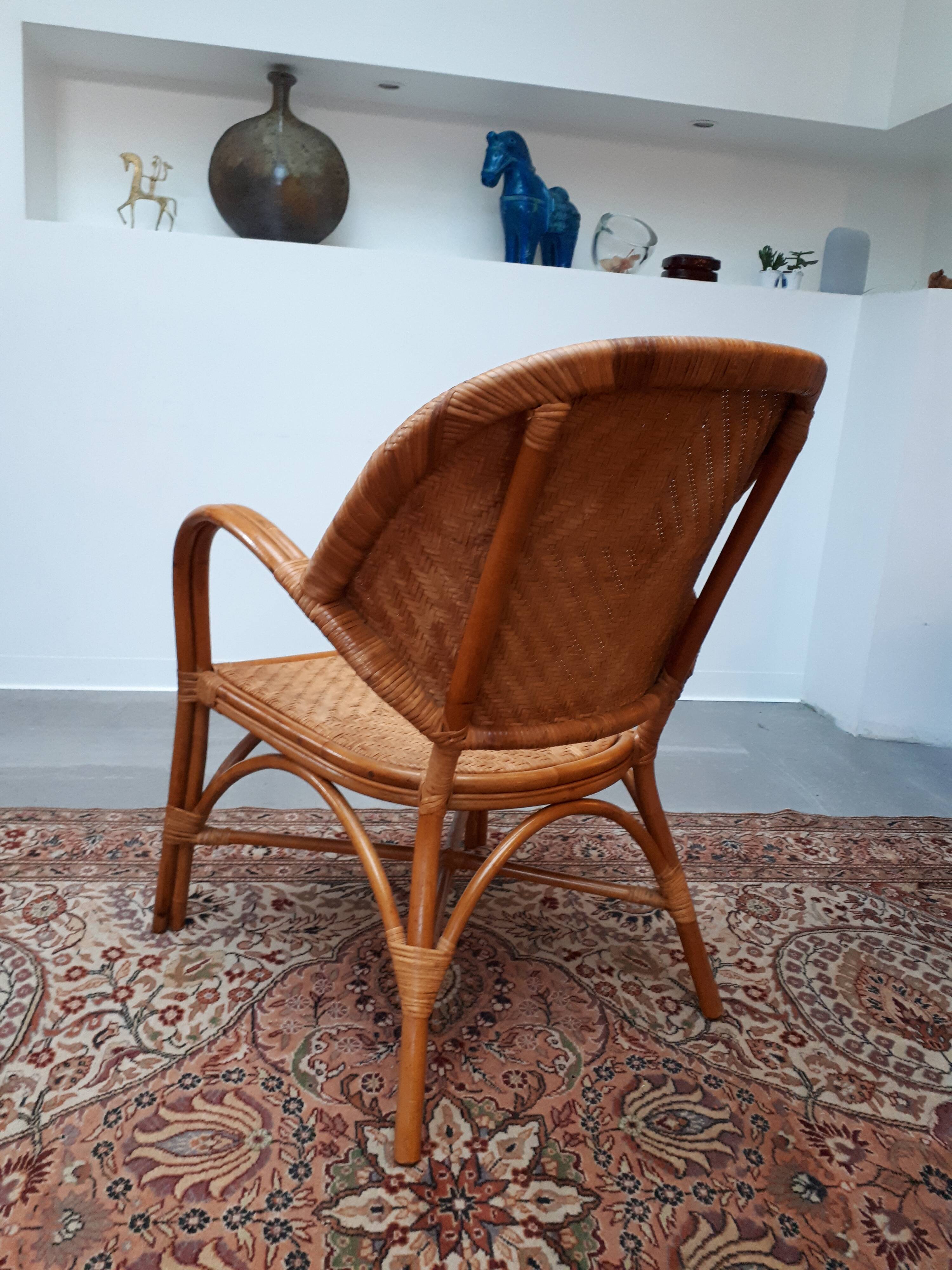 Pair of armchairs in braided rattan 70s