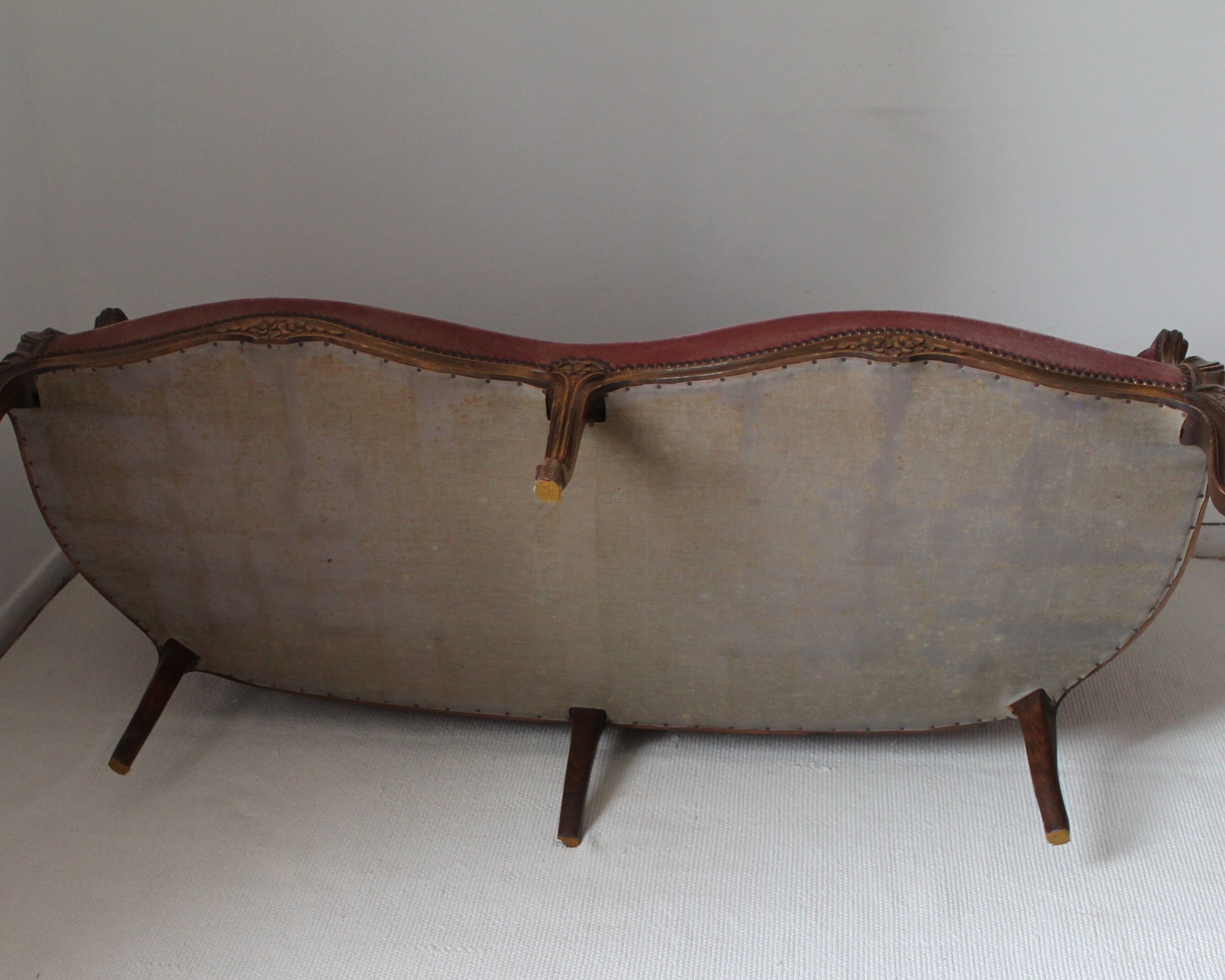 Faded pink velvet sofa