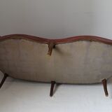 Faded pink velvet sofa