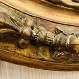 Large golden oval mirror