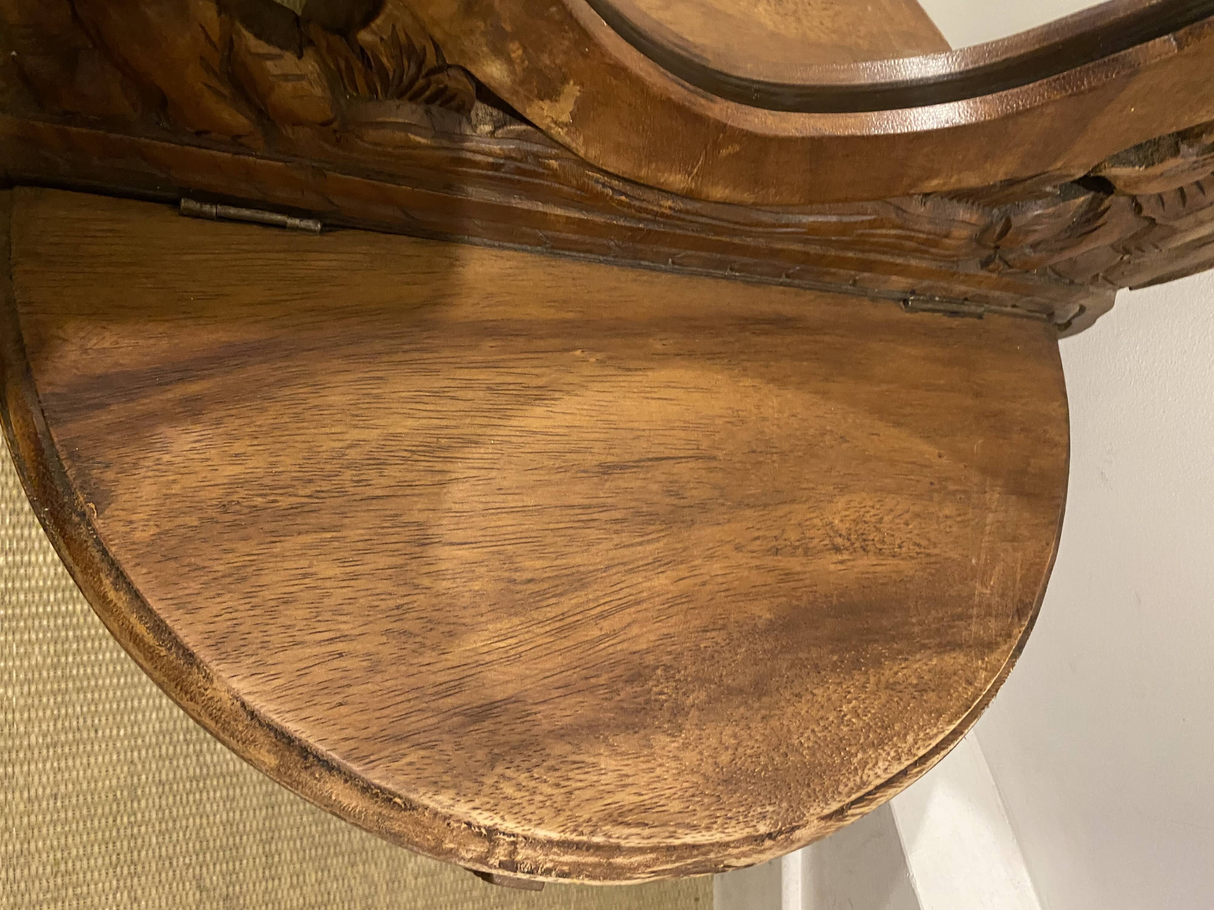 Carved mirror with integrated shelf