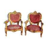 pair of gilded wooden ceremonial chairs