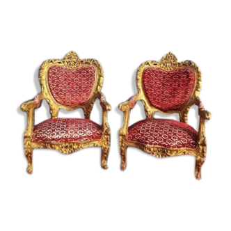 pair of gilded wooden ceremonial chairs