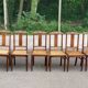 6 Art Deco dining chairs made of solid oak with caning from the 1950s.