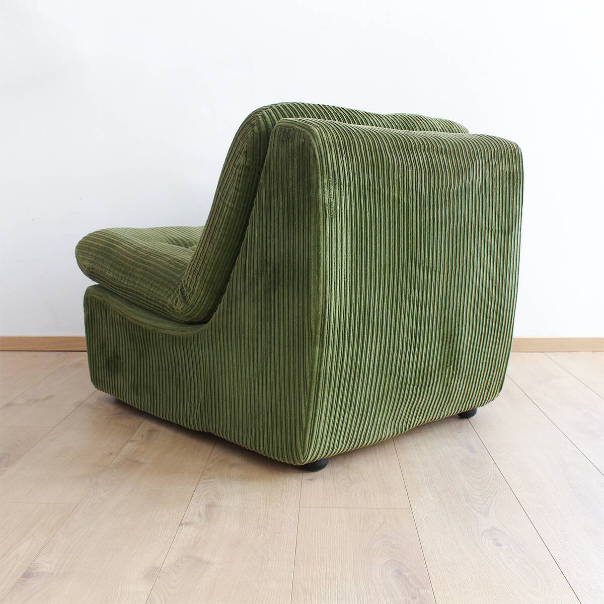 Modular vintage sofa with green cord upholstery
