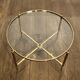 Neoclassical Round Coffee Table in Brass with Fluted Supports and Floral Motifs