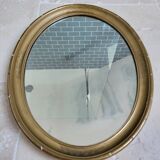 Oval mirror in gilded stucco 45 cm