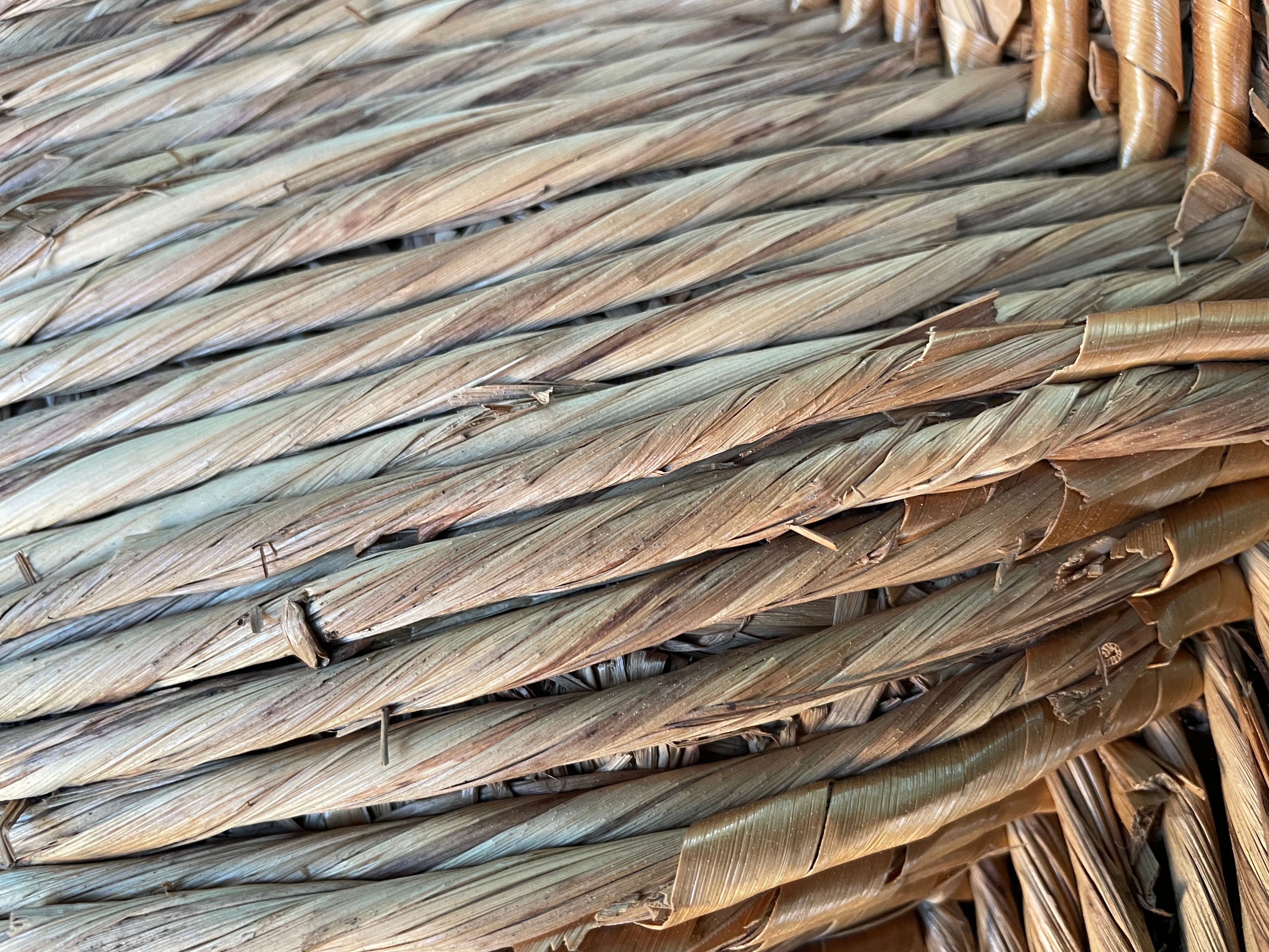 Vintage armchair in straw and brutalist wood