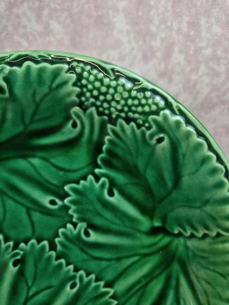 Set of 2 green earthenware dessert plates with vine decoration.