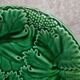 Set of 2 green earthenware dessert plates with vine decoration.