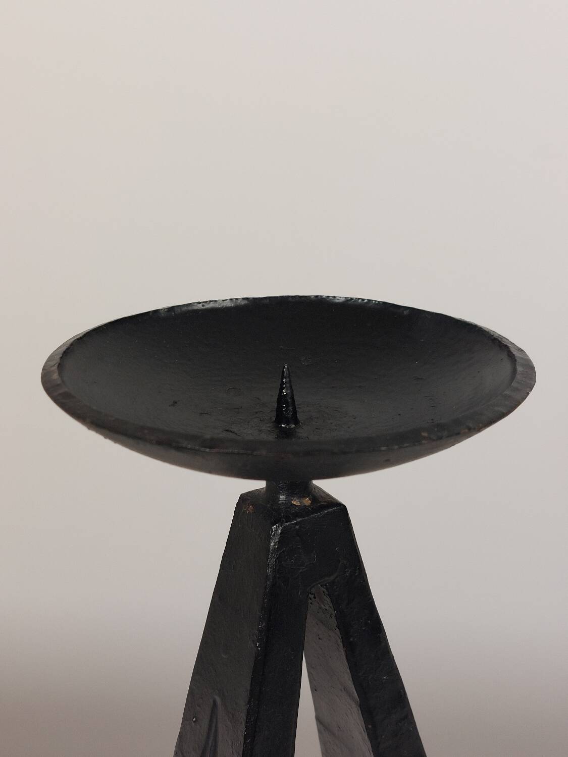 Vintage candle holder made of hand-forged metal, in a brutalist style.