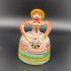 Trio of ceramic bell figurines