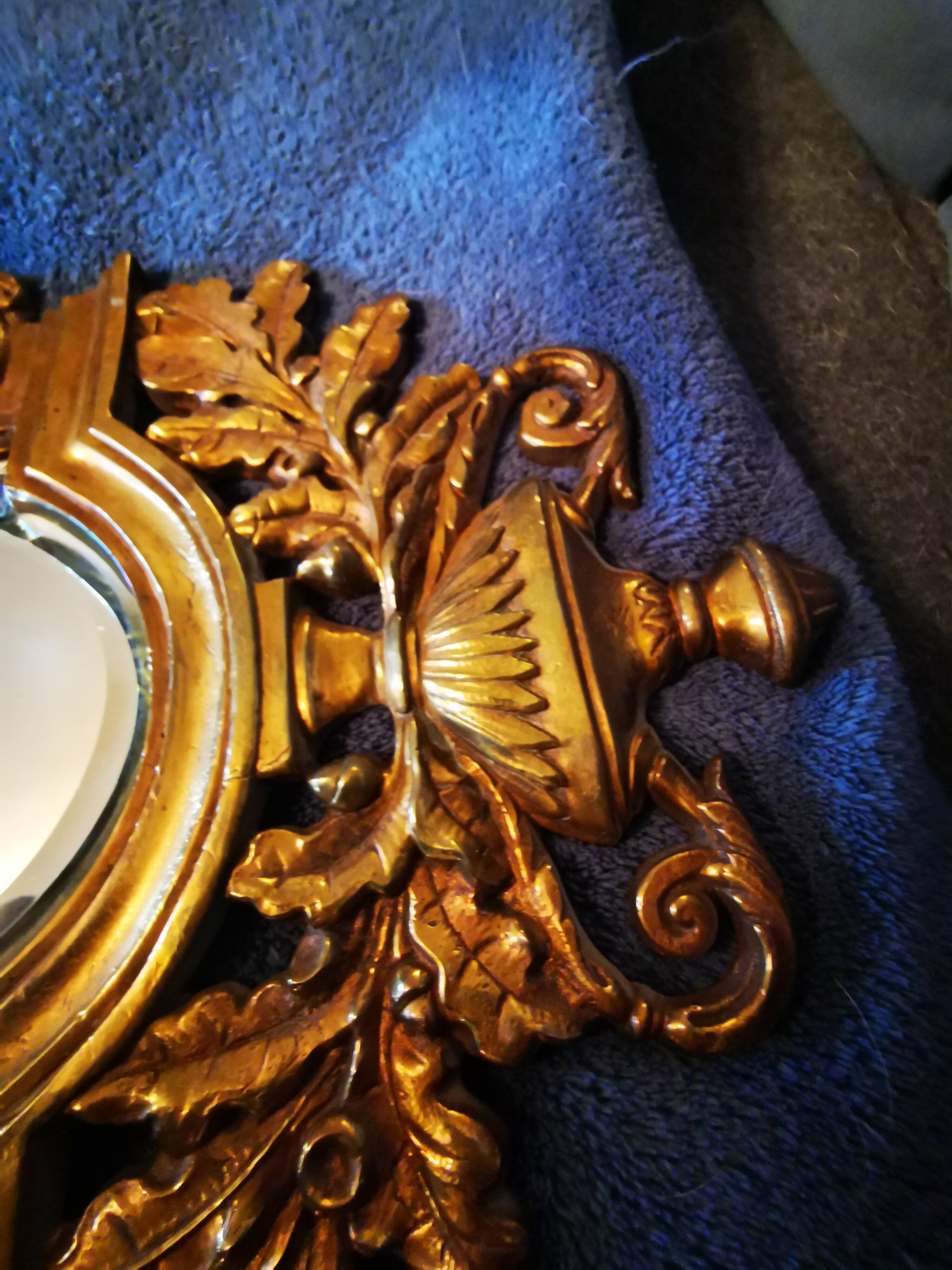 Pair of chissed and gilded bronze mirrors forming appliques