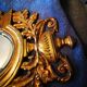 Paire de miroirs en bronze ciselé et doré formant appliques
