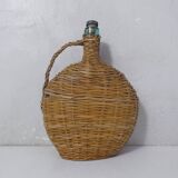 old bottle dressed in rattan vintage pilgrim gourd