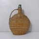 old bottle dressed in rattan vintage pilgrim gourd