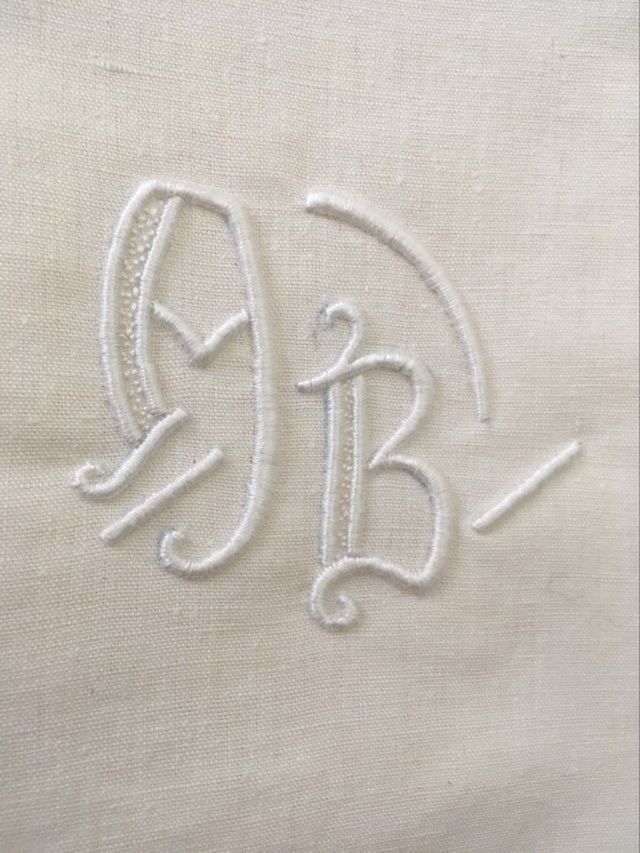 Pair mixed pillowcases embroidered A B.
