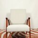 Vintage light gray armchair dark wood Scandinavian design 1970