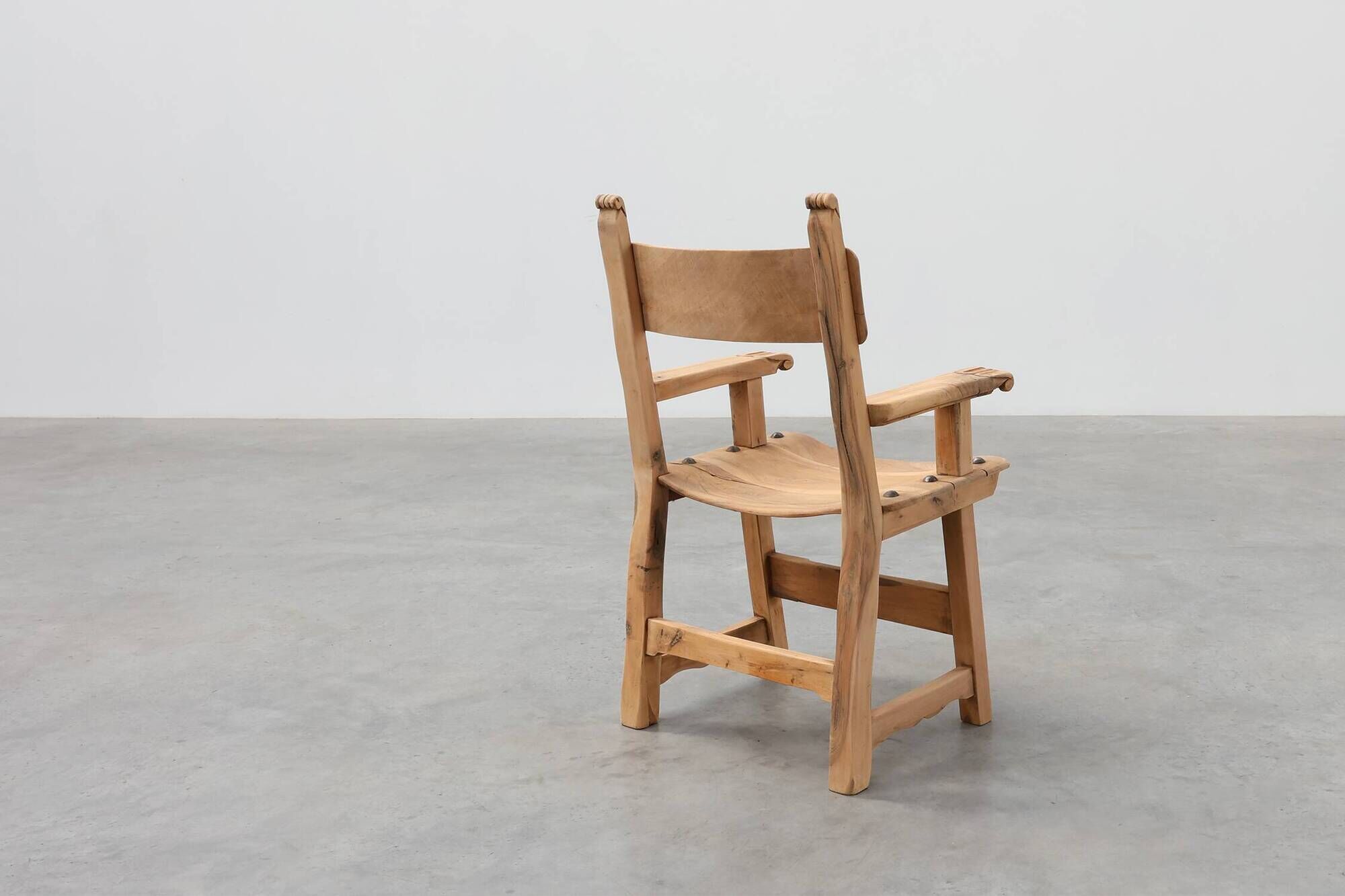 Brutalist armchair with carved rosettes and nailed wooden seat, Spain, 20th