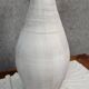 Vintage whitewashed pottery and wicker vase circa 1980