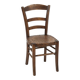 Antique wooden chair with a pyrographed shell motif seat.