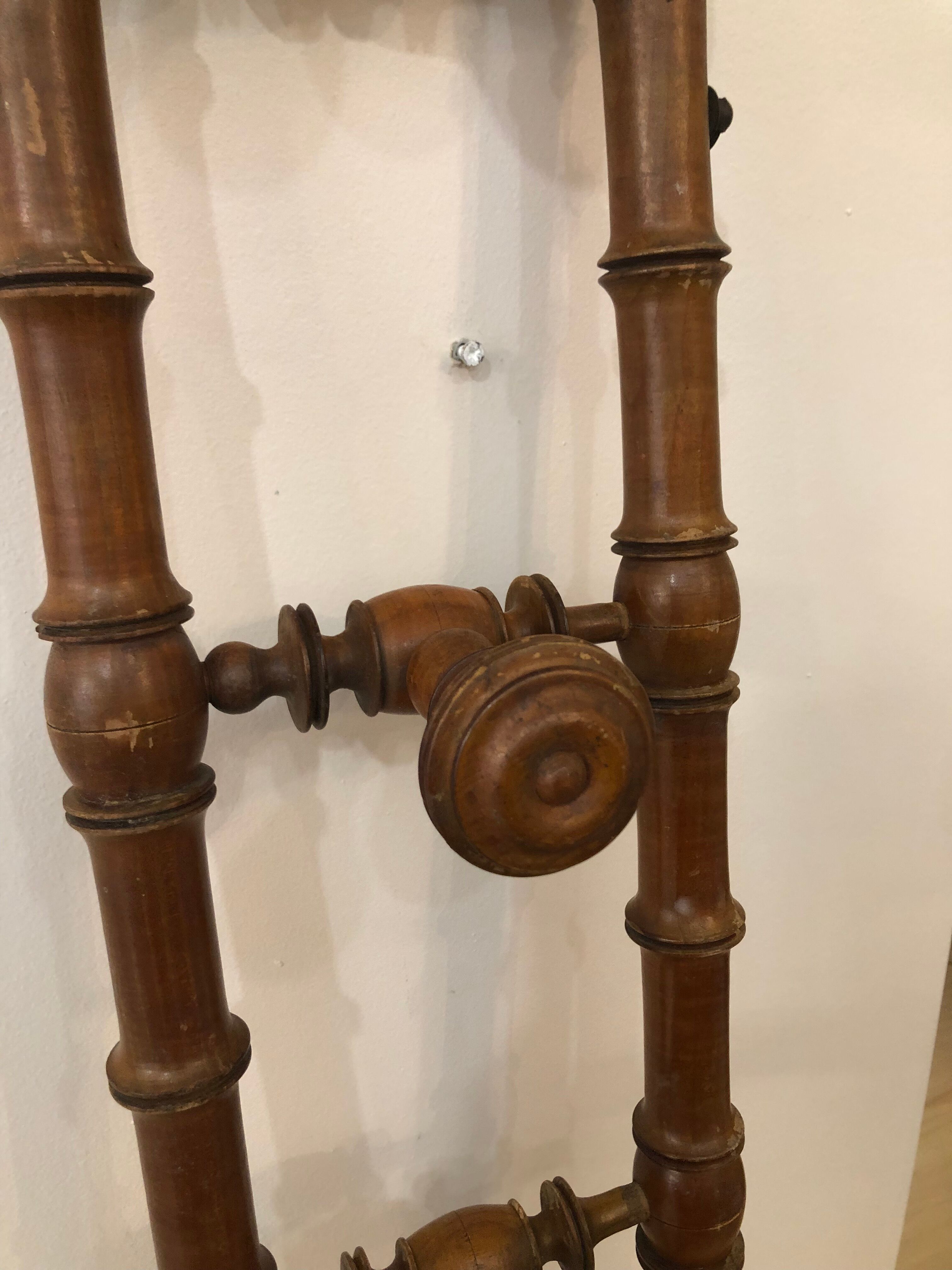 Wooden coat rack with swivel hooks