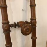 Wooden coat rack with swivel hooks