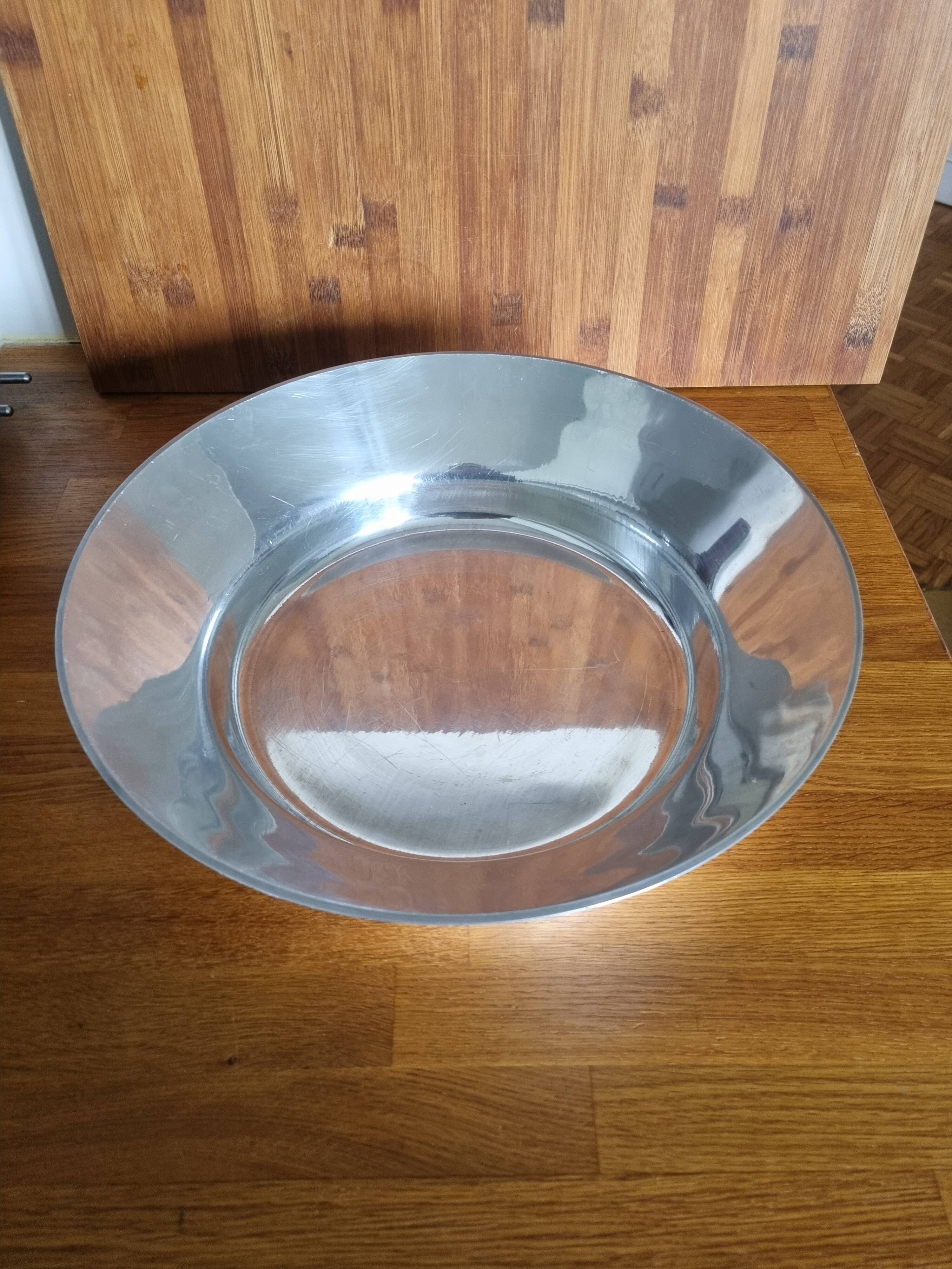Large round hollow metal dish