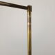 Articulated brass floor lamp