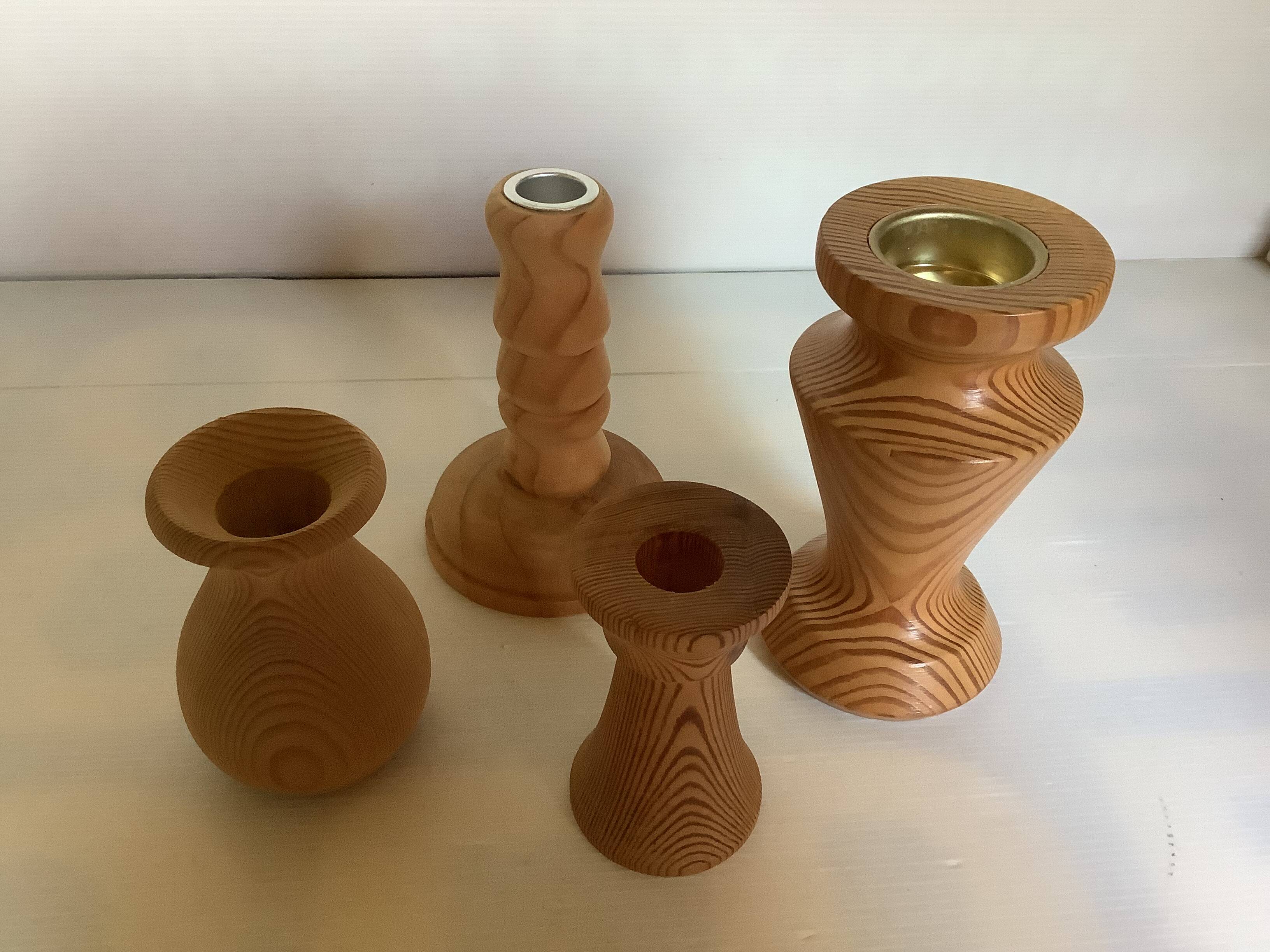 Four wooden vases and candlesticks