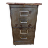 Vintage industrial metal furniture with a rusty effect, featuring two drawers on wheels.
