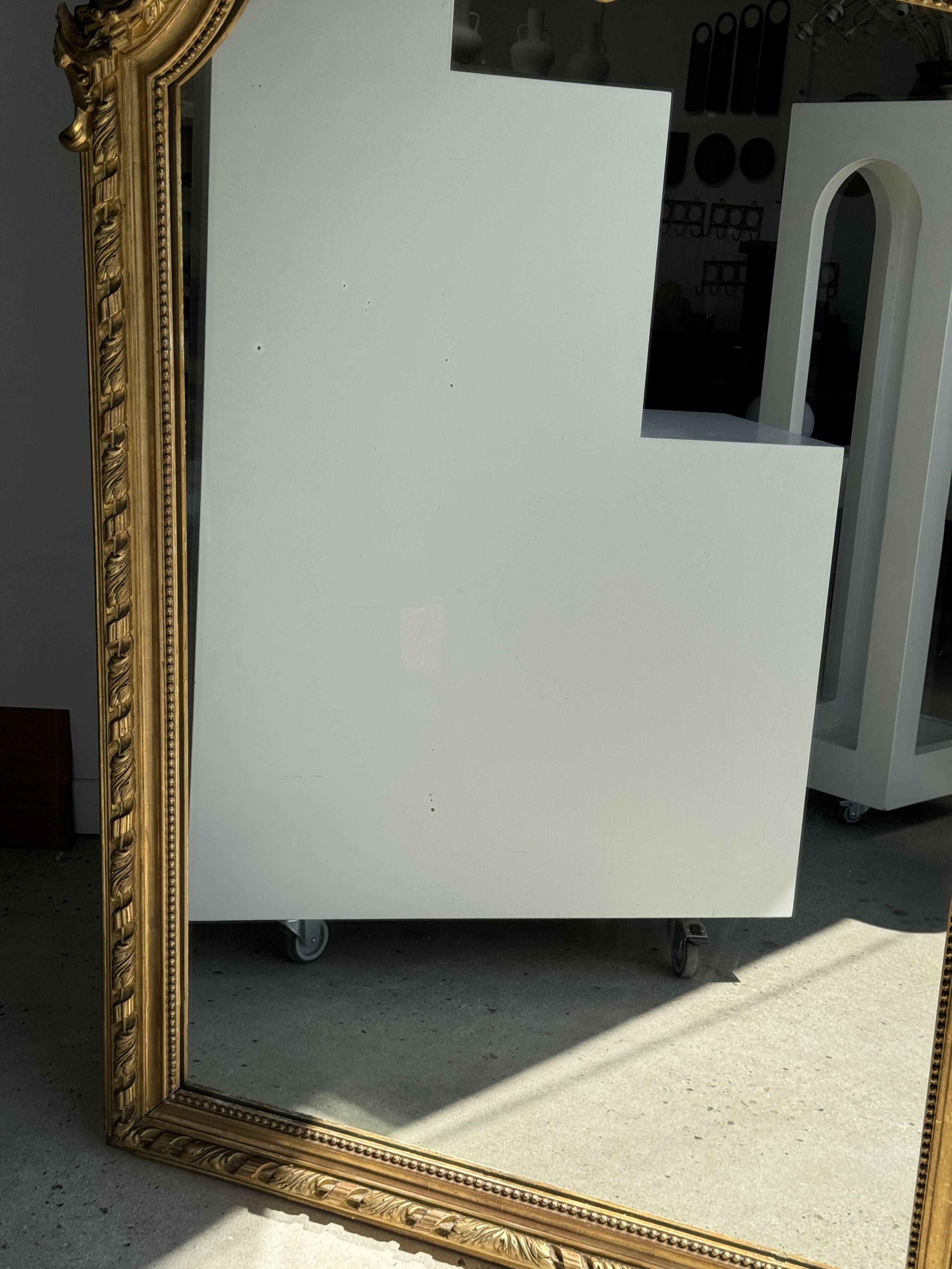 Large gilded mirror with acanthus leaf pediment H150 L98