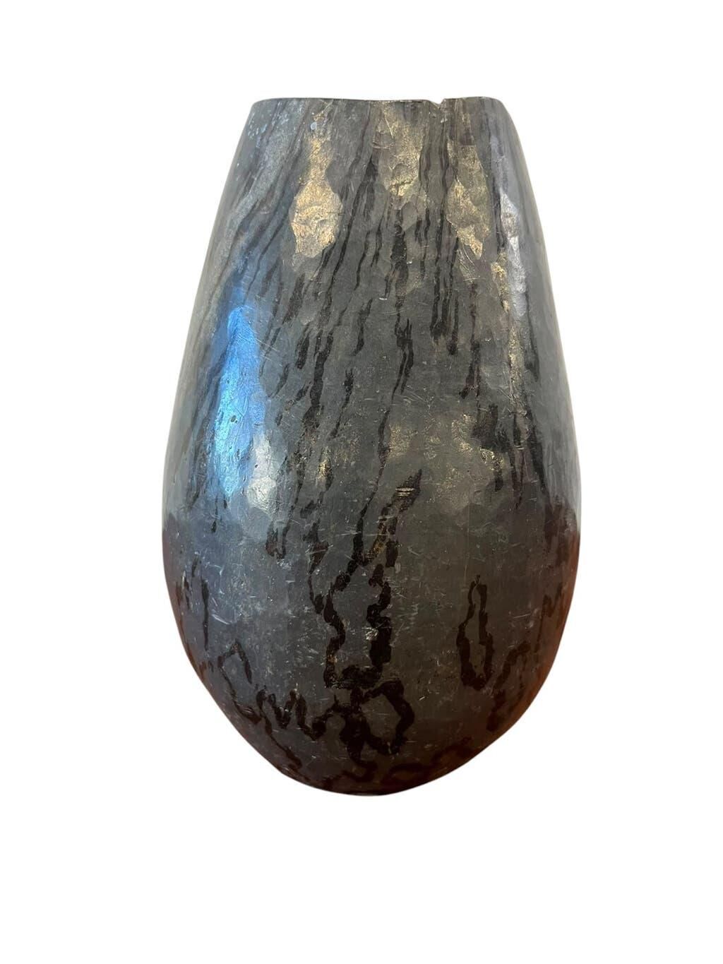 Vintage stone vase with worked fossil