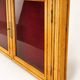 Vintage wall display cabinet in moulded wood and glass – burgundy background