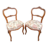 Pair of Louis XV chairs in carved walnut.