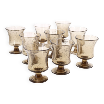 Nine stemmed glasses by Biot, brown bubble glass