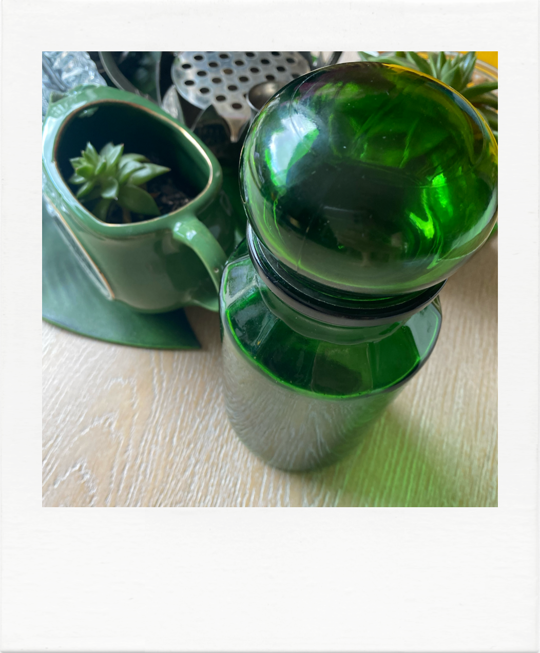 Emerald green glass bottle