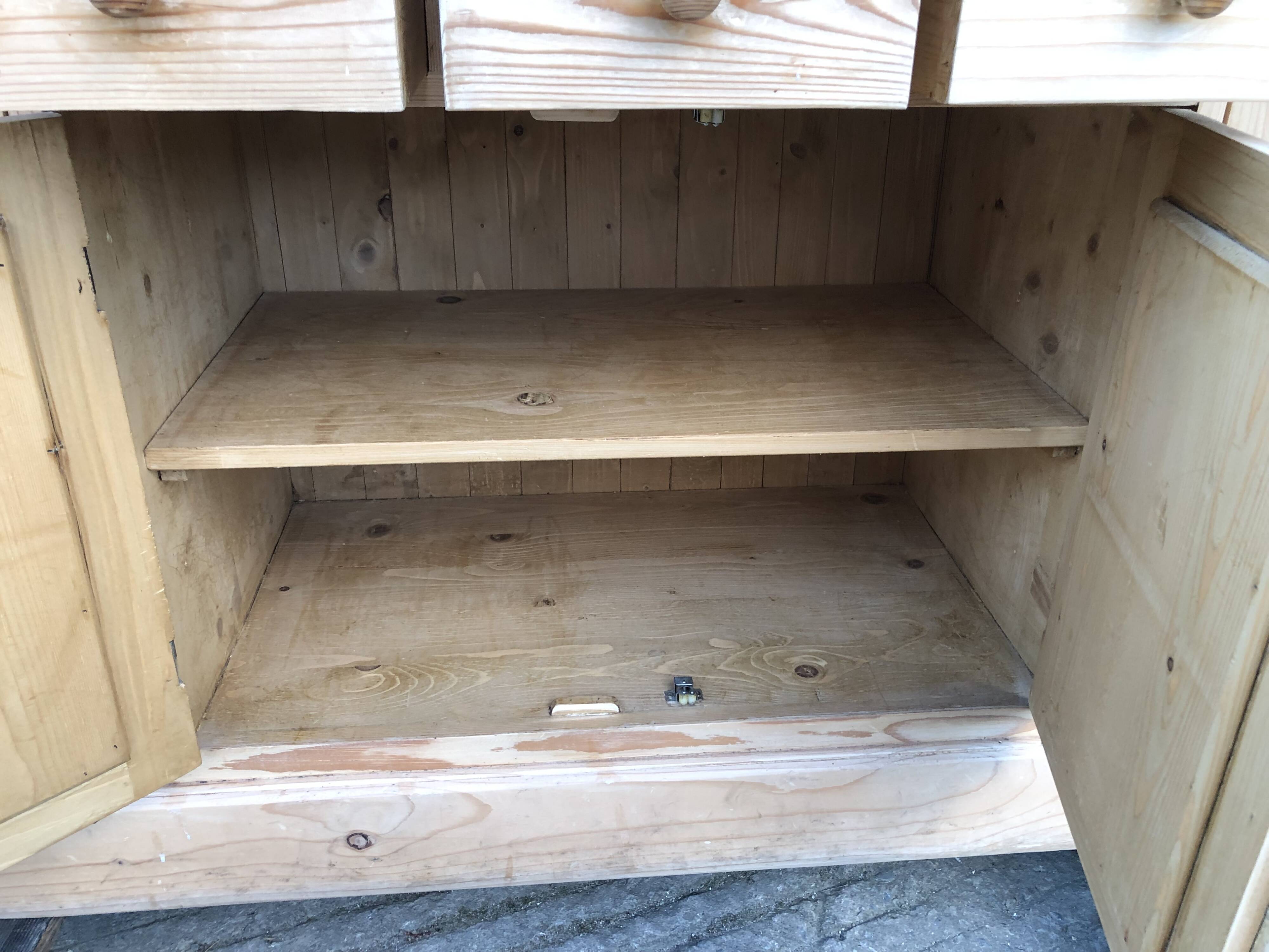Scandinavian natural pine sideboard with 4 doors and 6 drawers.