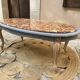 Oval coffee table in marble and wood