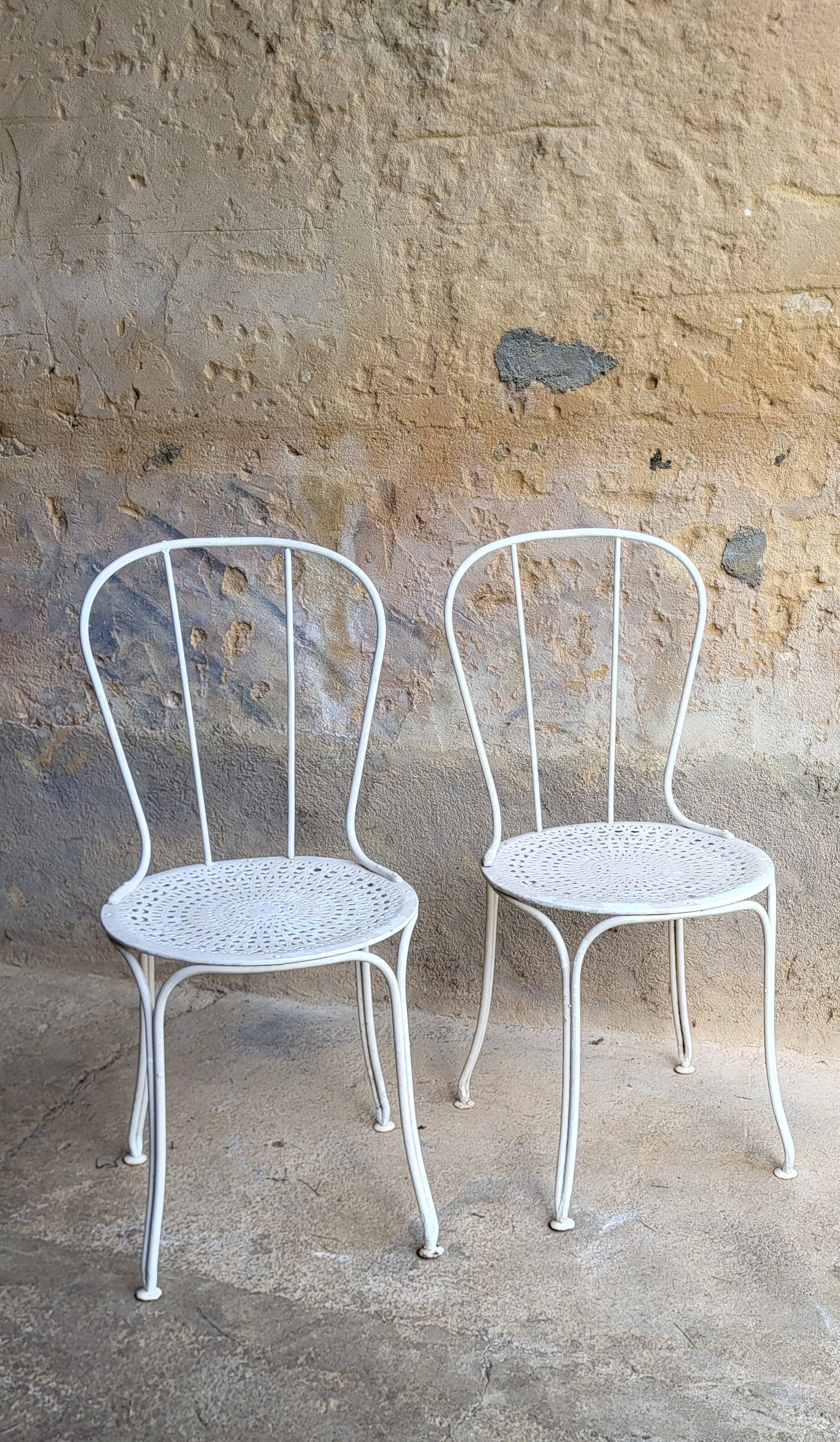 Pair of iron garden chairs