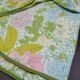 Nappe ronde à décor de fleurs vers 1970