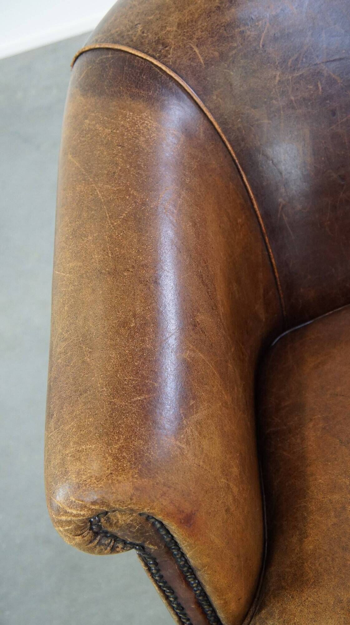 Characterful sheepskin leather club armchair with a luxurious, rustic appearance