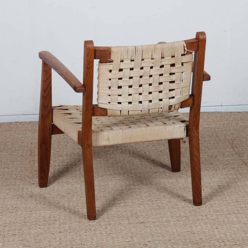 Armchair in solid oak and rope, 20th-century work.