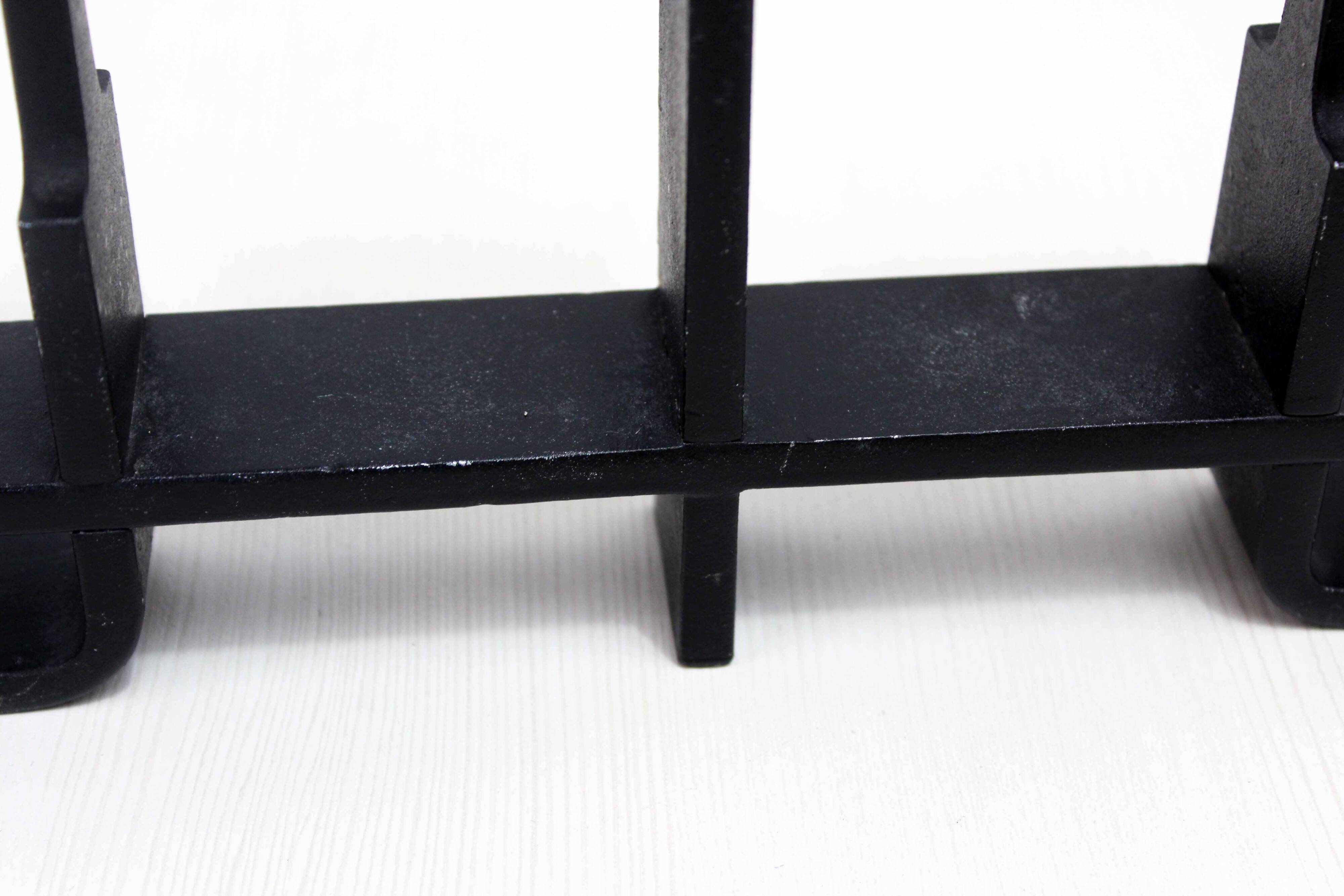 Modernist cast iron candle holder