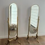 Pair of brass cheval mirrors in neoclassical style