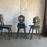 Set of 3 vintage wooden accent chairs painted navy blue, with 1920s decorated backs.