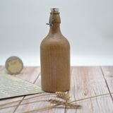 Small wooden sandstone bottle