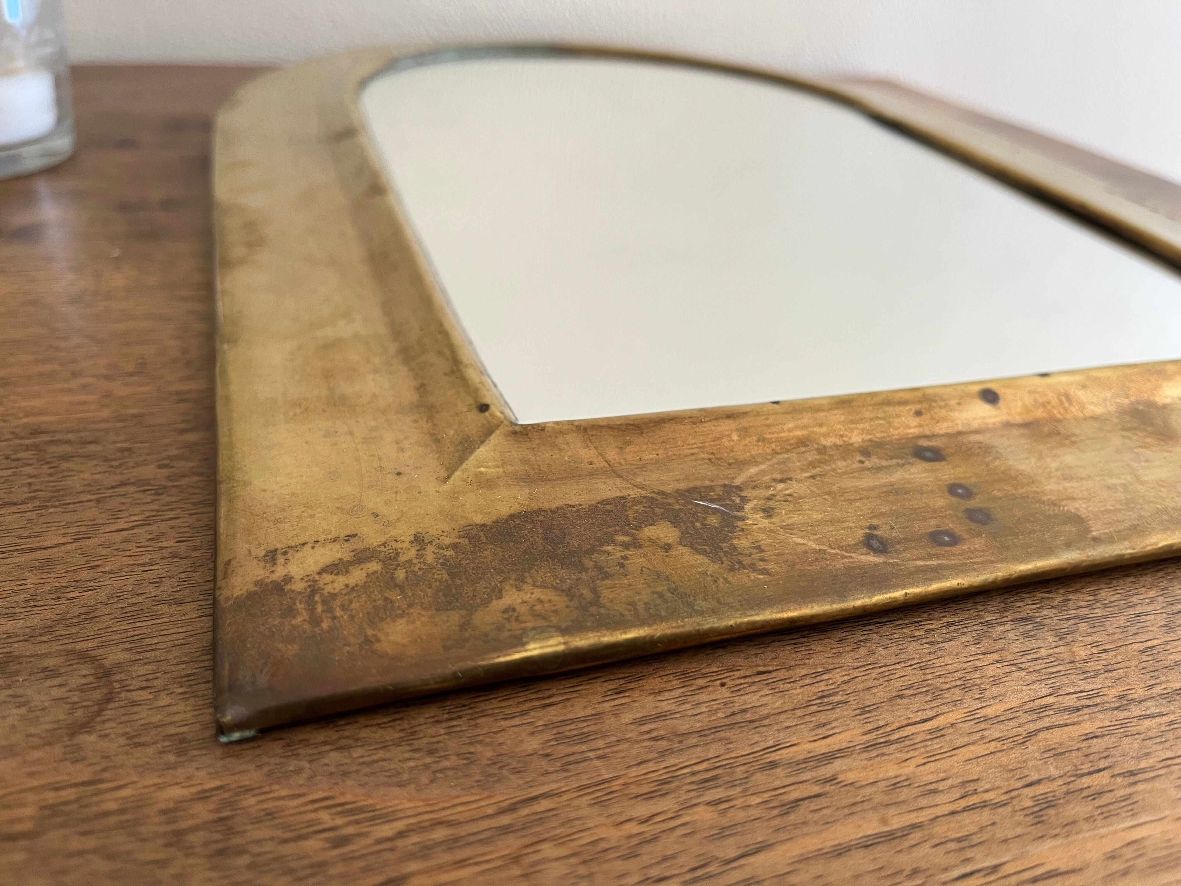 Brass half-moon mirror
