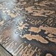 Vintage round wooden coffee table with a copper top.