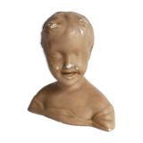 Bust of a small child in ancient plaster